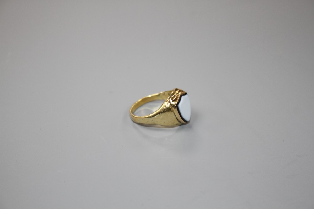 A Victorian yellow metal (probably 18ct) and shield shaped sardonyx poison ring, size L/M, gross weight 5.2 grams.